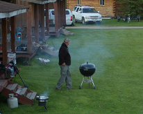 Guest enjoying BBQ at Anderson's Manitou Falls Camp