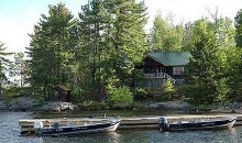 Boats and cabin at Campfire Island Camp