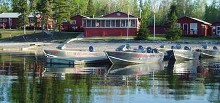 Pine Beach Lodge fishing boats and guest cabins