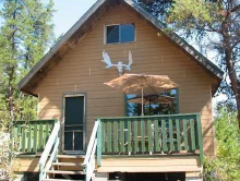 outpost cabin with moose antlers at Shooting Star Camp