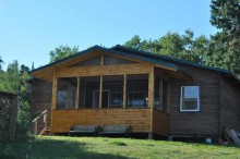 Guest cabin with screen porch at Sydney Lake Lodge