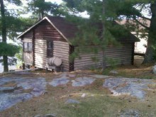 Guest cabin overlooking lake at Tamarack Island Wilderness lodge