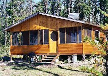 Outpost cabin with screen porch at Thunderhook Fly-Ins