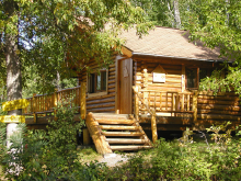 log housekeeping cabin at Tinker's Places