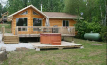 Guest cabin with hot tub at Windy Pine Cottages