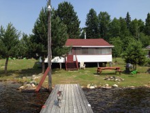 Guest cabin and dock at 3 Seasons Camp