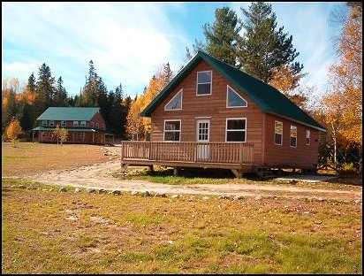 Guest cabin with deck at Lake Ogascanan Lodge and Outposts