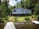 Boat dock and guest cabin at Chalets du Huard