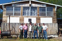 Fishermen outside of main lodge at Cheemo Lodge