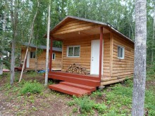 log guest cabins at Jug Bay Sport Fishing
